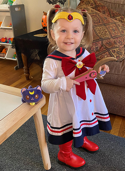 little girl toddler with white dress and red boots