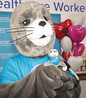 A seal in a furry costume representing the hospital's new mascot