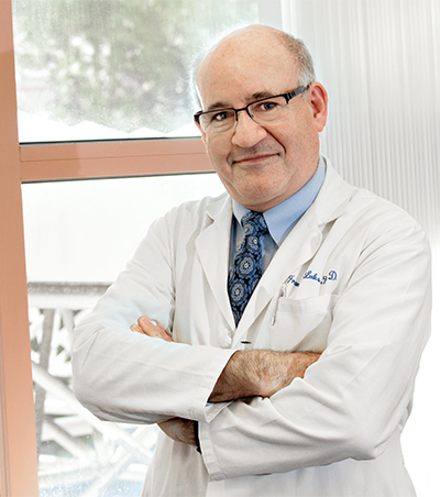 Francois I. Luks, MD, PhD stands by window