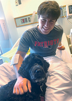 2025 Caring for Kids new pet therapy dog Cora with patient