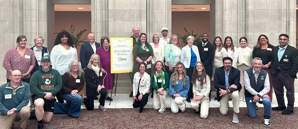 Award recipients posing in Hill courtyard at Newport Hospital