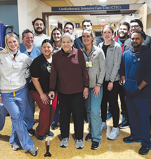Allan poses with entire care team in the cardiac unit
