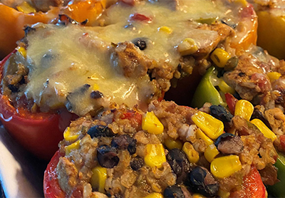 chipotle chicken stuffed peppers with melted cheese on top